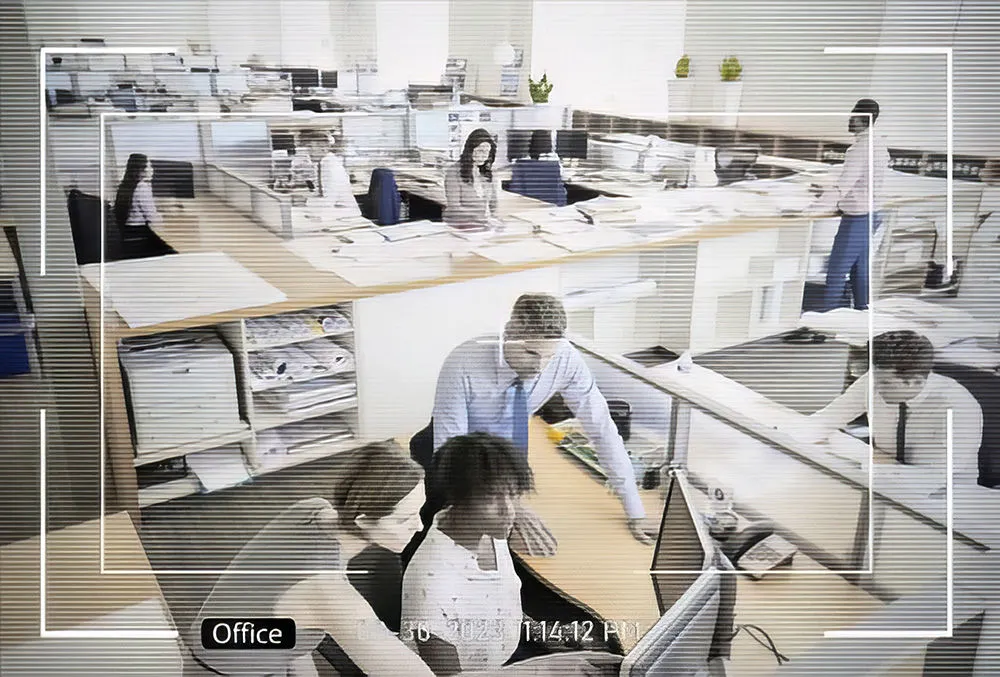 Office CCTV View - Security camera monitoring an open office workspace for enhanced employee safety and productivity.